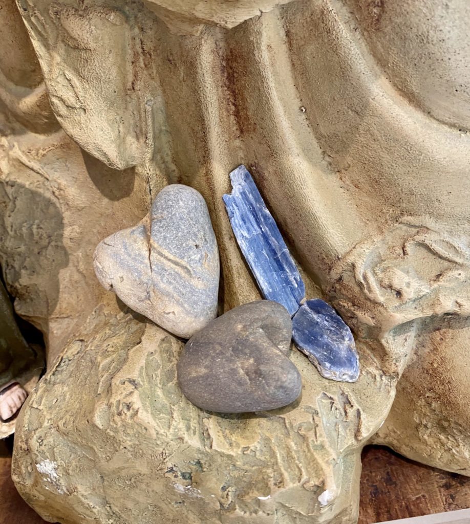 Three stones: beach rocks and a stick of kyanite